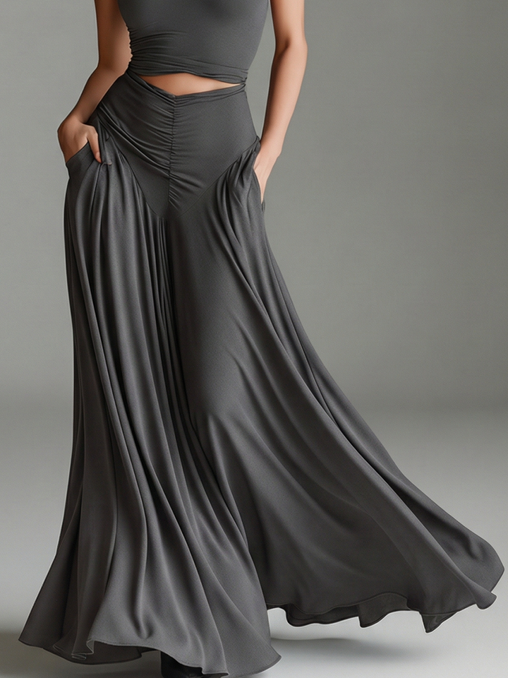 Sophisticated women's gray halter maxi dress, featuring a flattering cutout waist and ruched fabric, ideal for formal occasions.