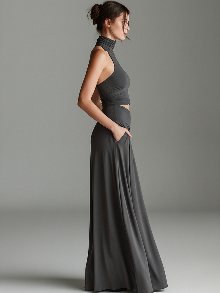 Stylish gray halter maxi dress for women, with an elegant cutout waist and ruched detailing, suitable for evening events.