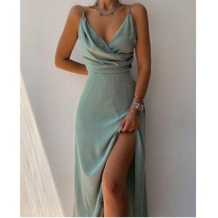 Women's flowy green formal V-neck spaghetti strap gown, ideal for special occasions, prom, or evening wear.