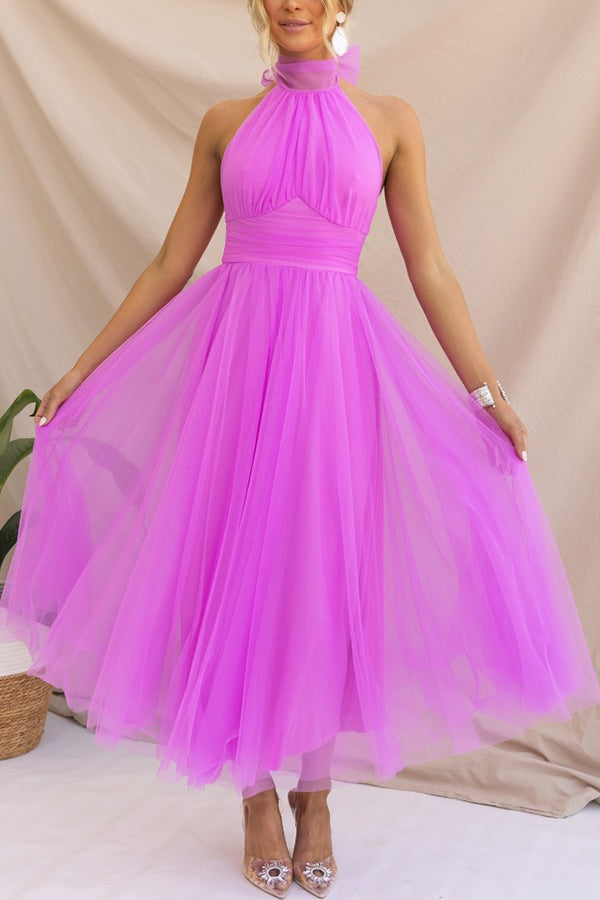 Elegant halter maxi dress for wedding guests, a sophisticated long formal gown for special occasions.