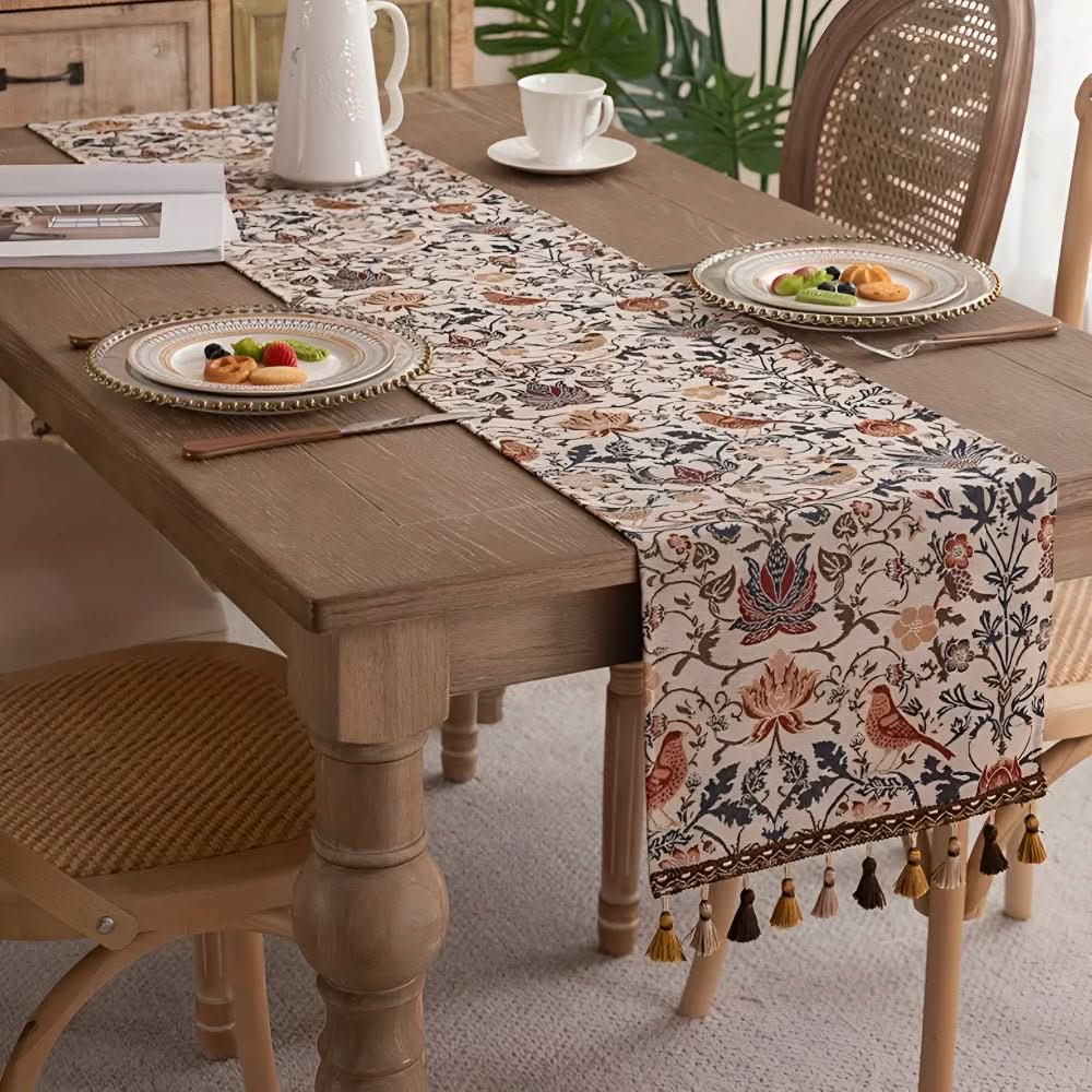 Elegant jacquard table runner with intricate floral and bird motif for dining table decor.