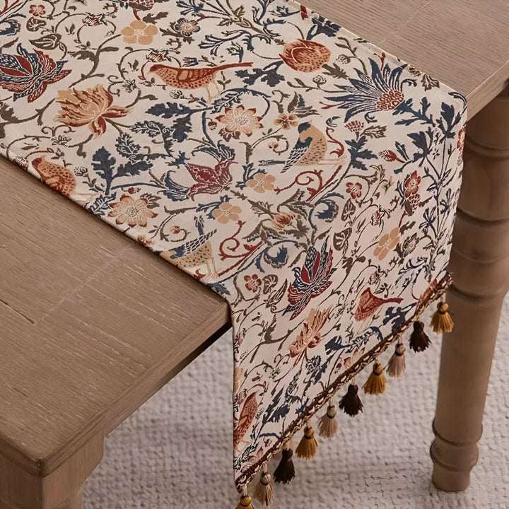 Stylish floral jacquard table runner with a charming bird motif, great for vintage-inspired spaces.
