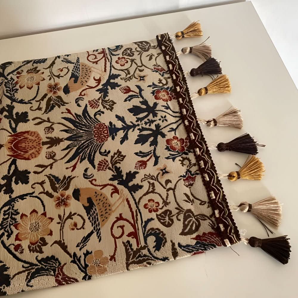 Sophisticated jacquard table runner with a detailed floral and bird pattern for festive dining decor.
