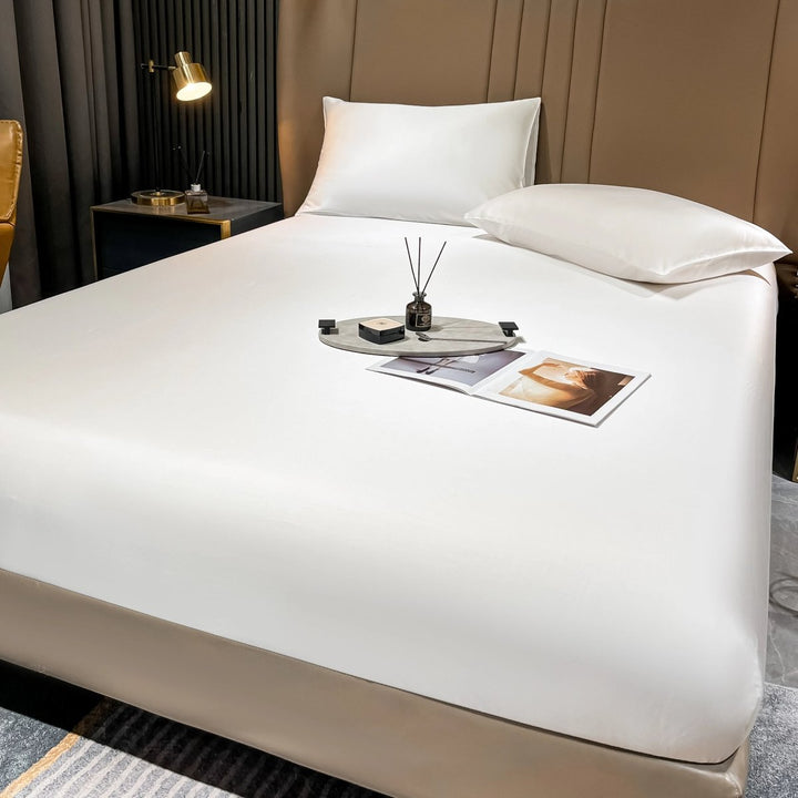 Luxury long-staple cotton fitted sheet with deep pocket for a snug fit. Premium bed linen for ultimate comfort.