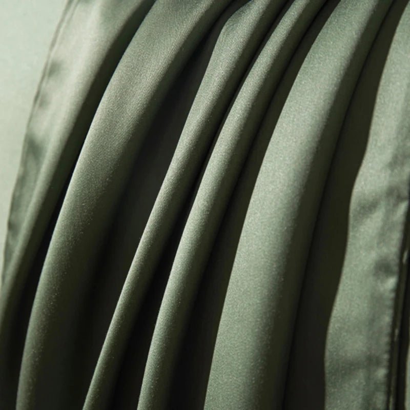 Deep pocket fitted sheet in elegant long-staple cotton, ensuring a perfect, snug fit on various mattress sizes.