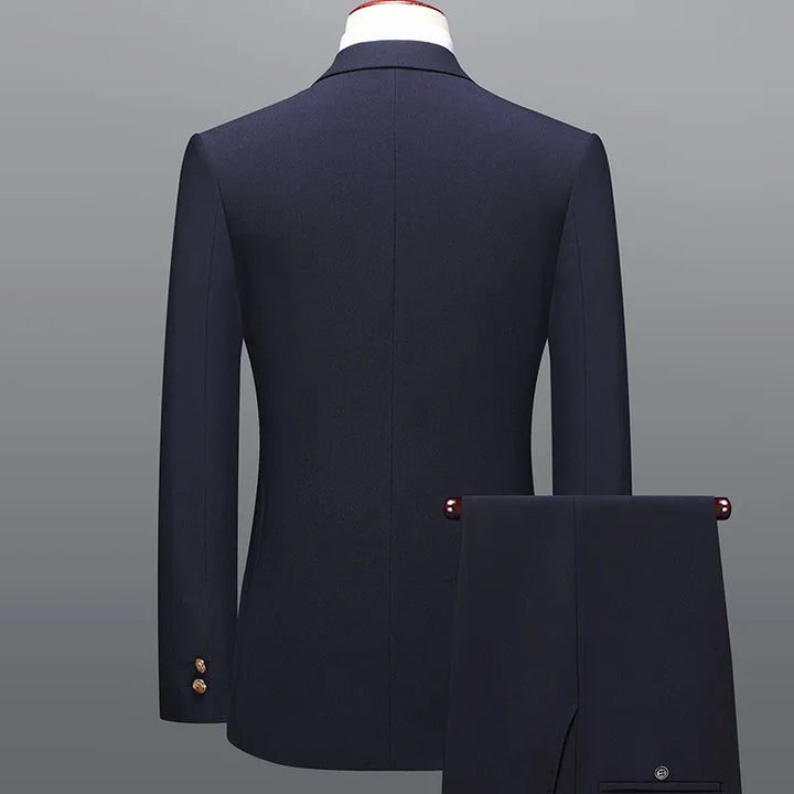 Slim fit dark blue double-breasted men's suit, ideal formal wear for weddings, business & special occasions.