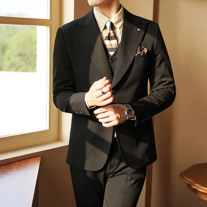 Black men's three-piece slim fit formal suit for elegant wedding & event wear.