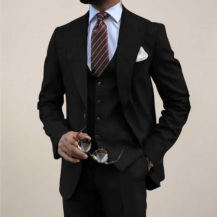 Stylish men's three-piece suit featuring blazer, waistcoat, and trousers, suitable for business & formal events.