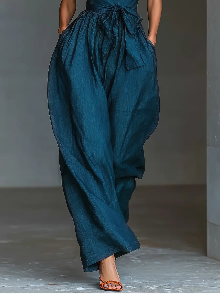 Stylish women's navy wide-leg halter jumpsuit, a comfortable and elegant choice for formal or occasion wear.