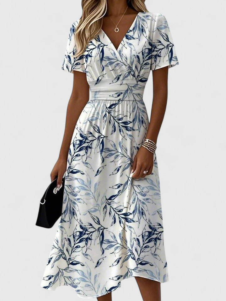 Elegant navy floral midi dress for women featuring a wrap V-neckline, flattering flutter sleeves, ideal for spring & summer.