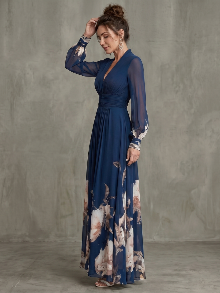 Women's formal navy V-neck maxi dress with elegant pleats and sheer long sleeves, creating a sophisticated silhouette.