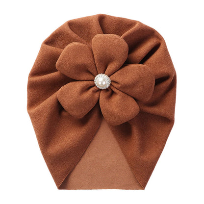 A collection of baby pearl turban hats in various soft colors, perfect for infant accessories.