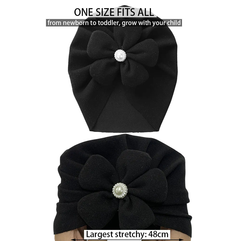Soft faux cashmere baby turban hat in a gentle blue, adorned with a sweet pearl flower.