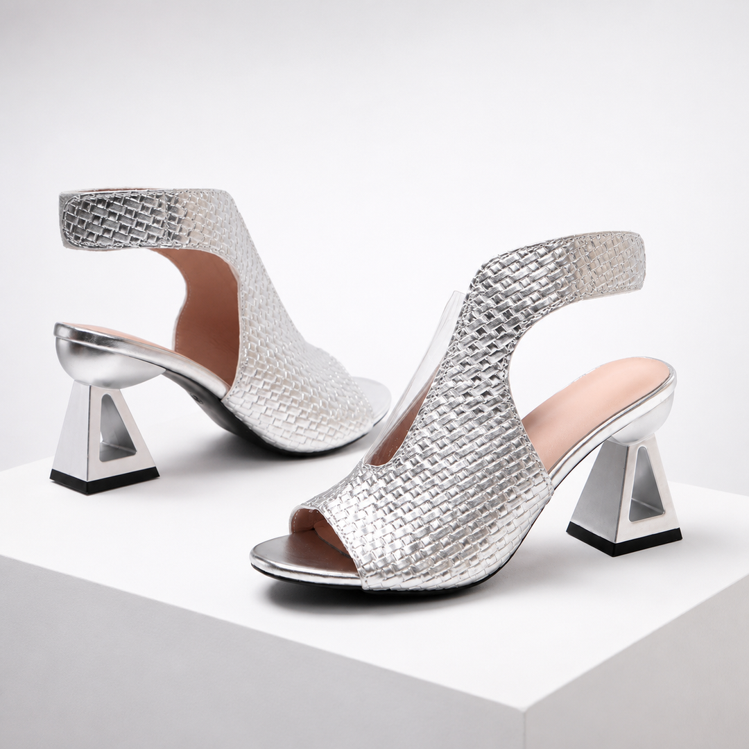 Contemporary women's open-toe slingback heels, featuring a sophisticated geometric heel for formal wear.