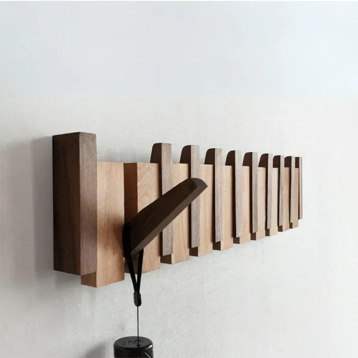 Elegant piano coat rack for entryway. Modern wall hooks provide organized home decor & space-saving storage.