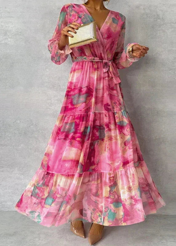 Women's long sleeve floral V-neck wrap maxi dress with tiered skirt. Ideal elegant party or summer wedding guest attire.