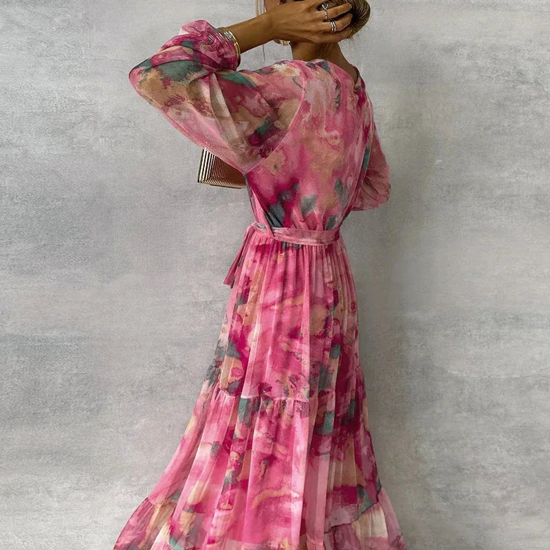 Stunning floral V-neck wrap maxi wedding guest dress for women. Elegant long sleeve design, perfect for summer parties.