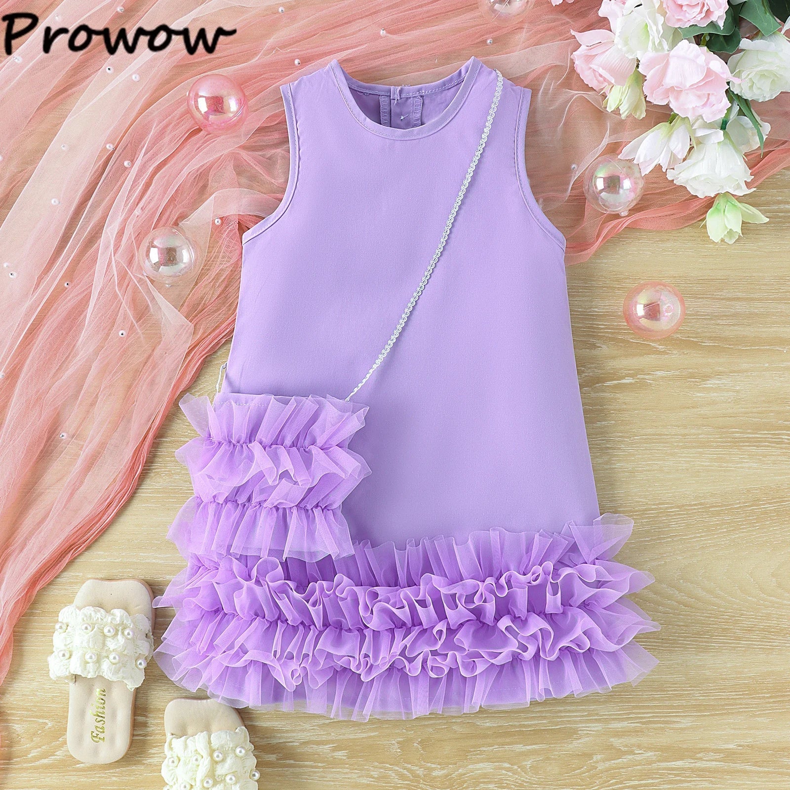Beautiful blue sleeveless princess dress for kids' parties, paired with a stylish shoulder bag
