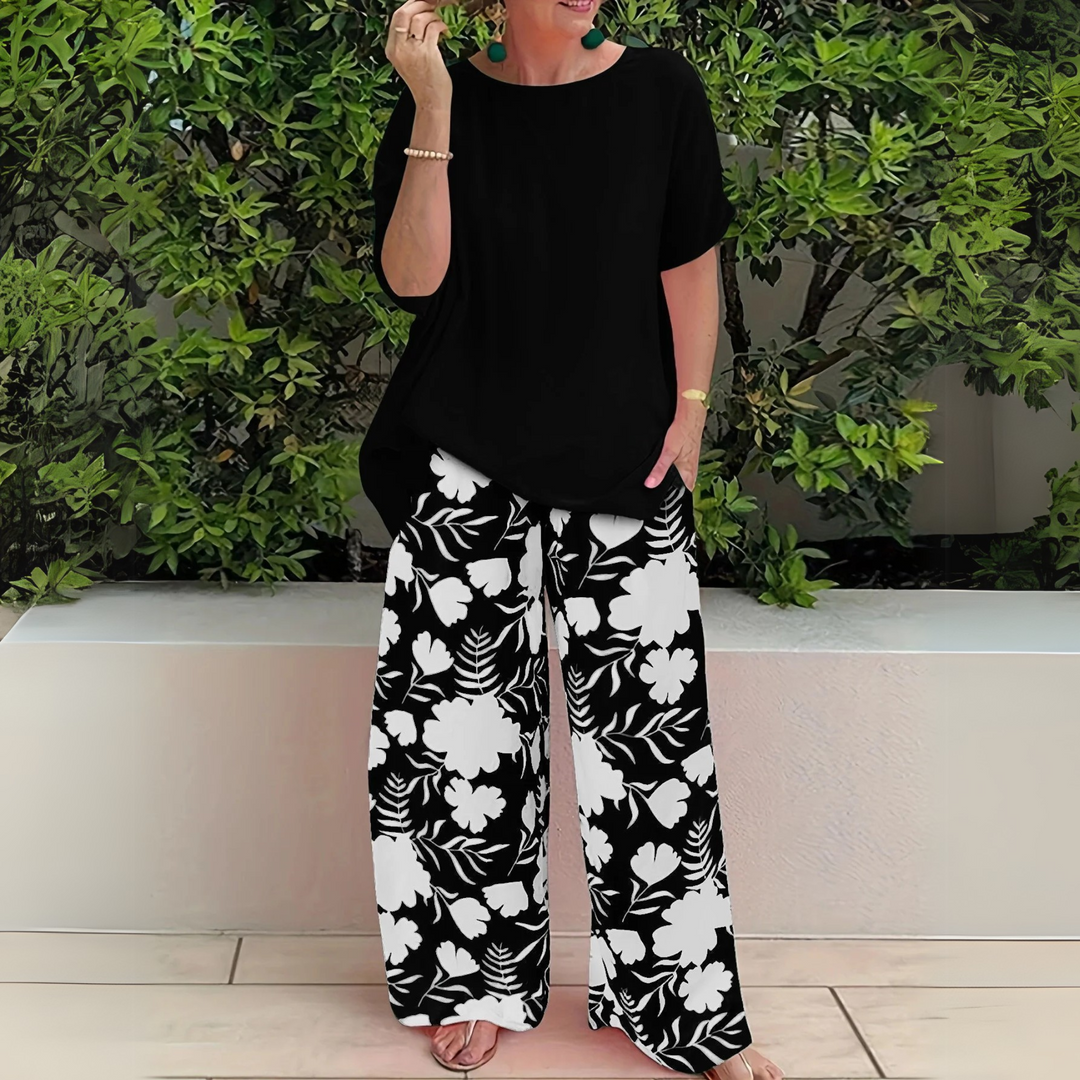 Comfortable plus size women's floral matching set. Two-piece lounge wear with wide-leg pants for elegant style.