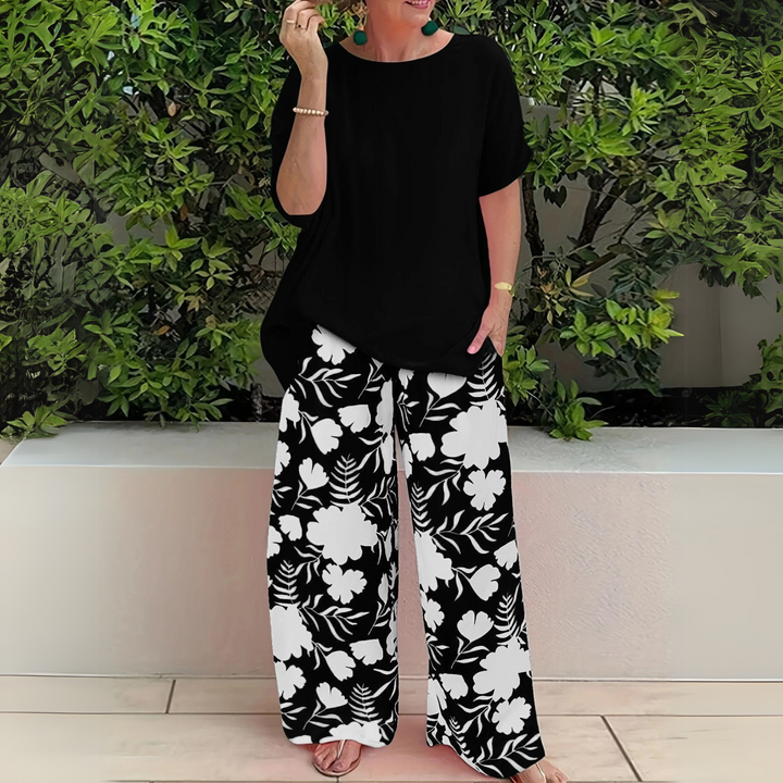 Comfortable plus size women's floral matching set. Two-piece lounge wear with wide-leg pants for elegant style.