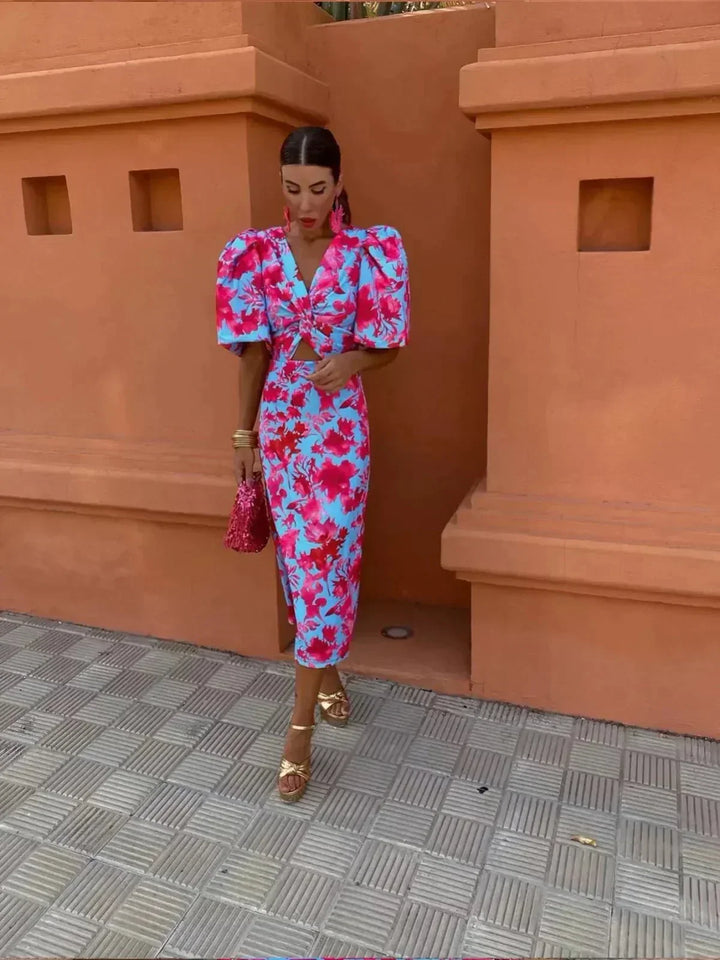 Women's elegant printed maxi dress featuring puff sleeves and V-neck, ideal for evening events or cocktail parties.