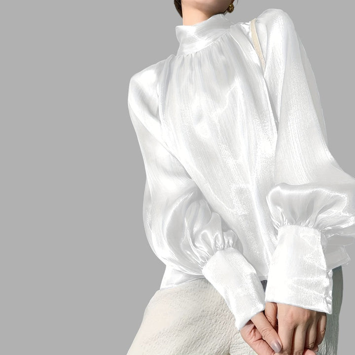 Light blue women's puff sleeve top, ideal for casual chic fashion and elegant daily wear.