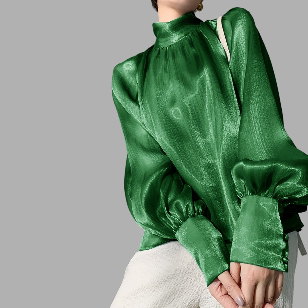Stylish blue puff sleeve blouse for women, offering a sophisticated and elegant fashion statement.