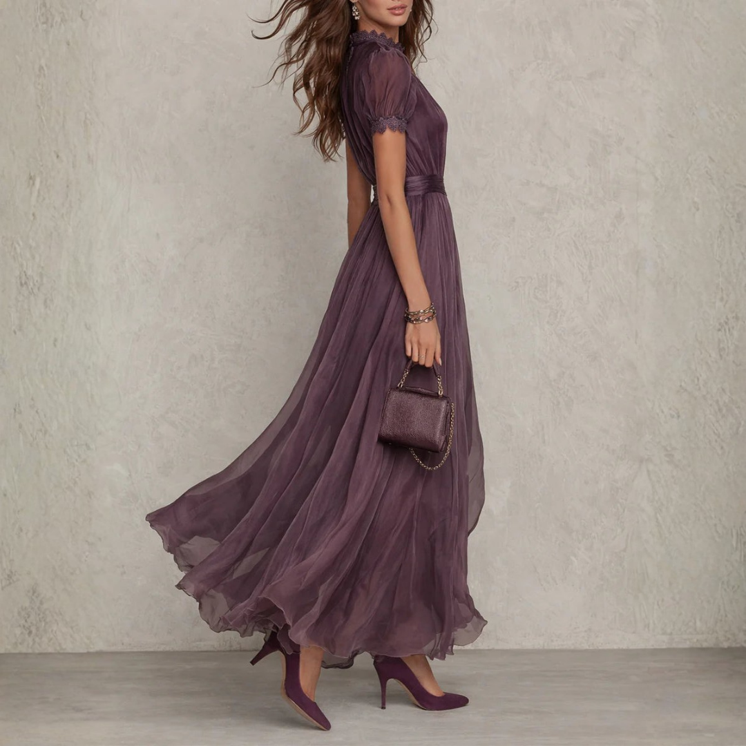 Formal purple evening gown for women, a flowing maxi dress with delicate lace trim, ideal for special occasions.