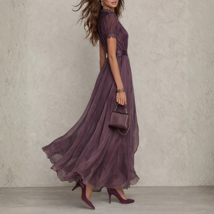 Formal purple evening gown for women, a flowing maxi dress with delicate lace trim, ideal for special occasions.