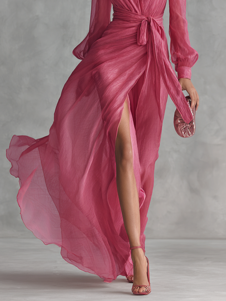 Full length view of a rose pink V-neck formal maxi dress with a tie-waist, an elegant outfit for party or event.