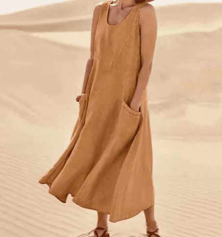 Elegant summer women's midi dress, featuring a comfortable loose fit, sleeveless design, and stylish, practical pockets.