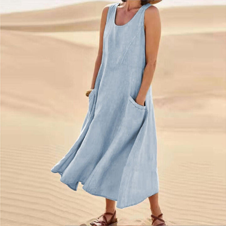 Versatile women's sleeveless midi dress, elegant for casual wear, comfortable loose fit, and essential pockets.