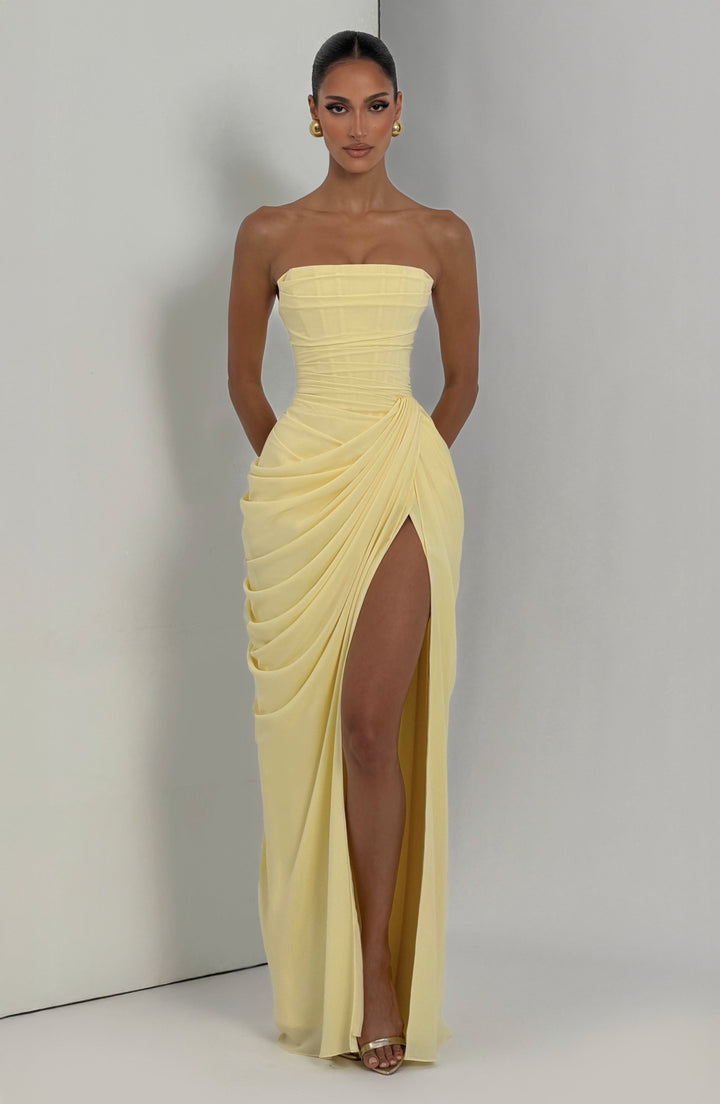 Elegant women's strapless party dress, sculpted corset bodice, and stylish column skirt with a slit.
