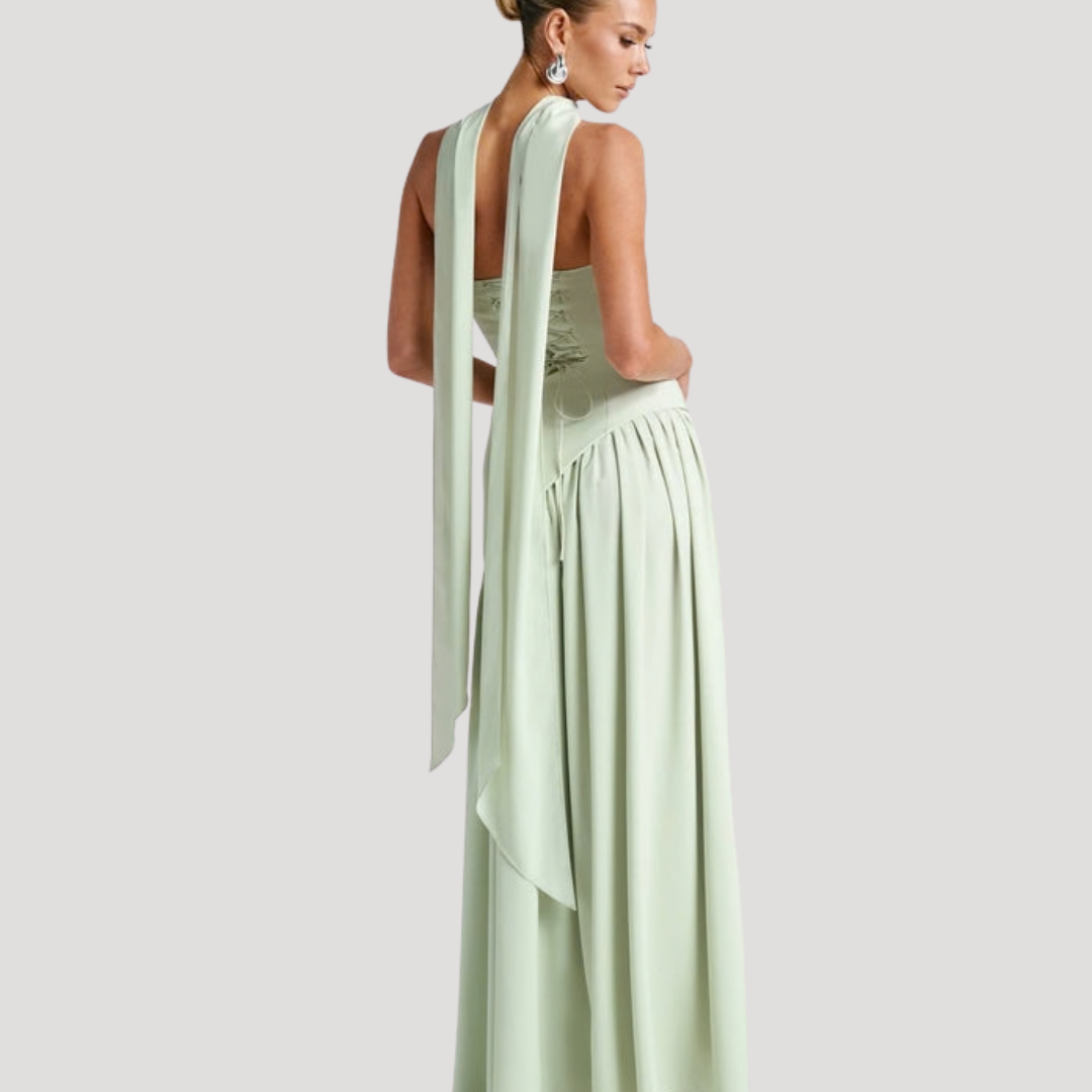 Women's formal strapless maxi dress with delicate pleats, ideal for special occasions.