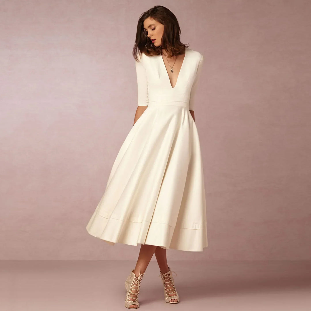 Elegant V-neck elbow-sleeve midi dress for women. Versatile style for formal, casual, or workwear.