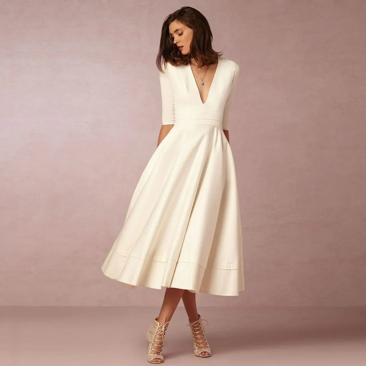 Elegant V-neck elbow-sleeve midi dress for women. Versatile style for formal, casual, or workwear.