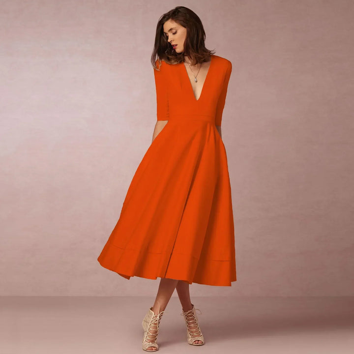 Modern women's V-neck elbow-sleeve midi dress. A stylish staple for any wardrobe.