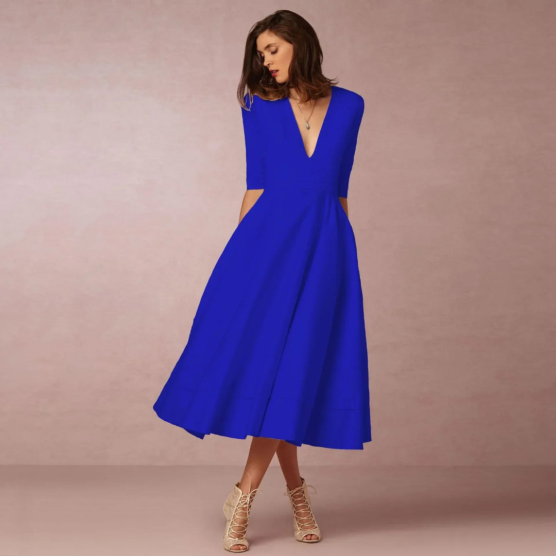 Elegant women's V-neck midi dress, featuring comfortable elbow sleeves. Perfect for classic style.