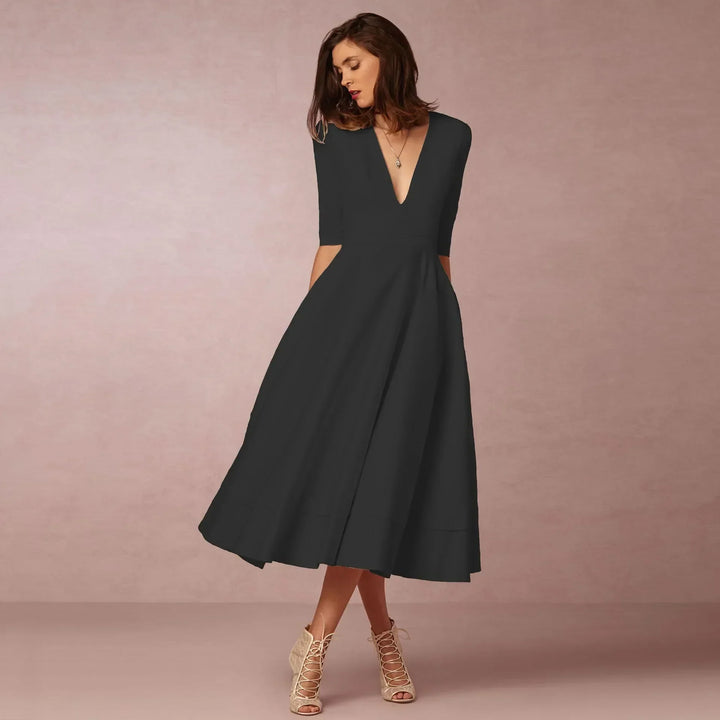 Chic women's V-neck elbow-sleeve midi dress. Essential for spring and summer elegant style.