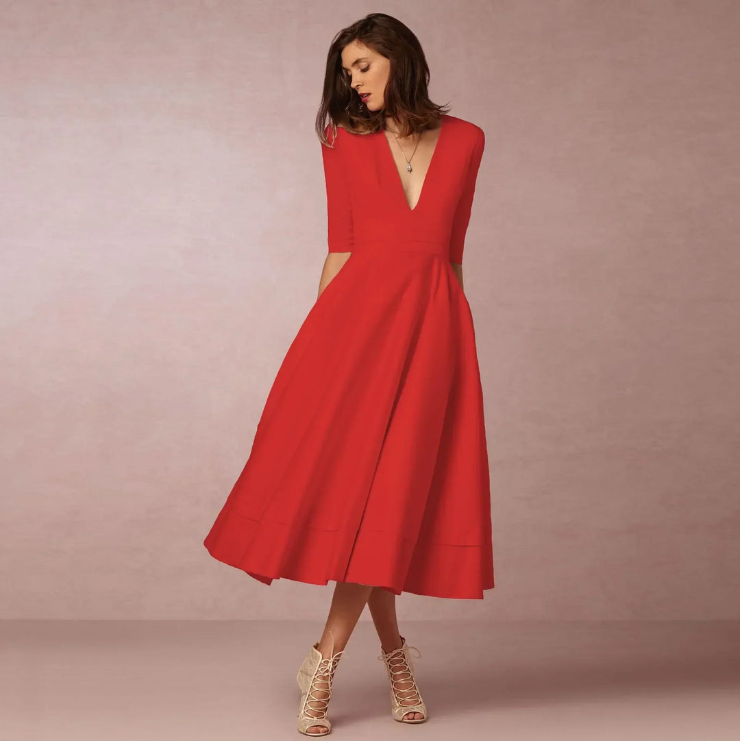 Detailed view of the elegant V-neck and elbow sleeves on a women's midi dress.
