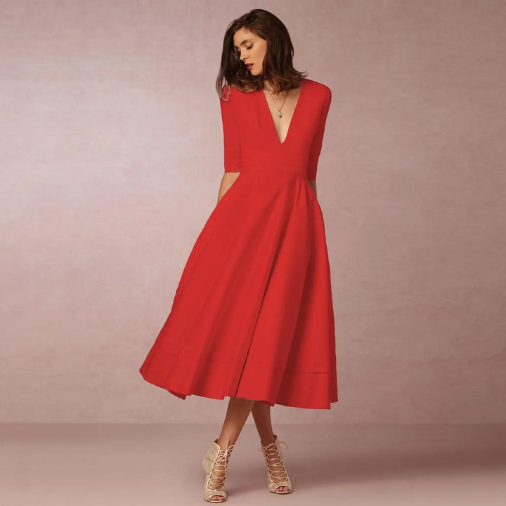 Detailed view of the elegant V-neck and elbow sleeves on a women's midi dress.
