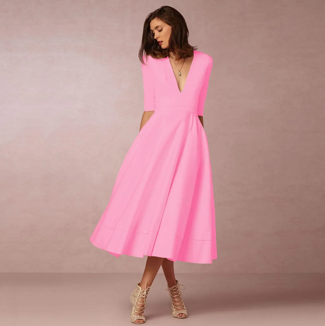 Flowing women's V-neck elbow-sleeve midi dress, showcasing its graceful movement.
