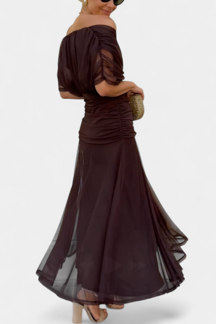 Women's flowing V-neck maxi dress with ruched waist, ideal for elegant evening wear or special occasions.