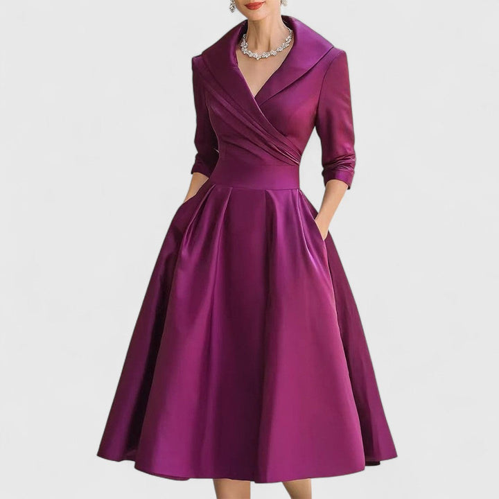 Women's sophisticated V-neck midi dress featuring 3/4 sleeves, ideal for any occasion.