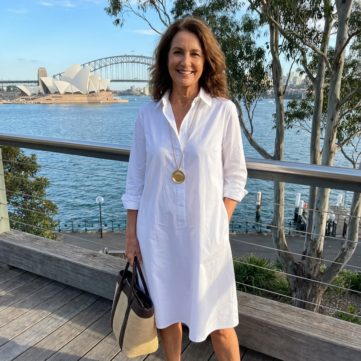 Chic women's white button-down midi dress with an A-line silhouette, perfect for timeless summer and formal occasions.