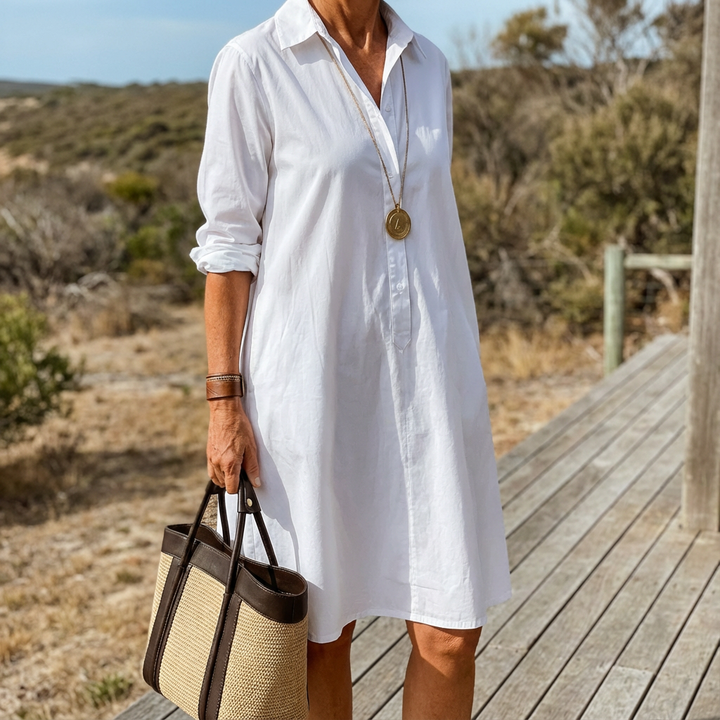 Versatile white collared midi dress for women, designed with a button-down front, offering an elegant & casual look.