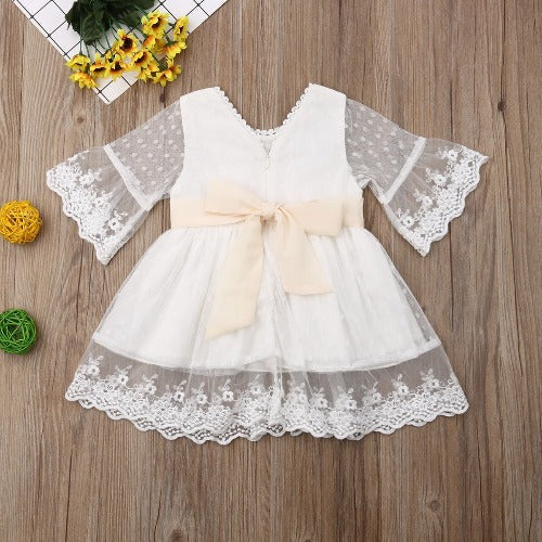 Vintage style white toddler dress with intricate floral lace, perfect for parties or formal events.