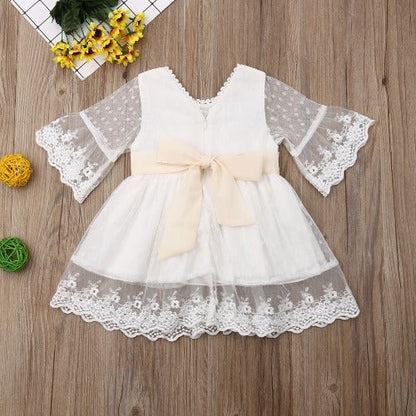 Vintage style white toddler dress with intricate floral lace, perfect for parties or formal events.