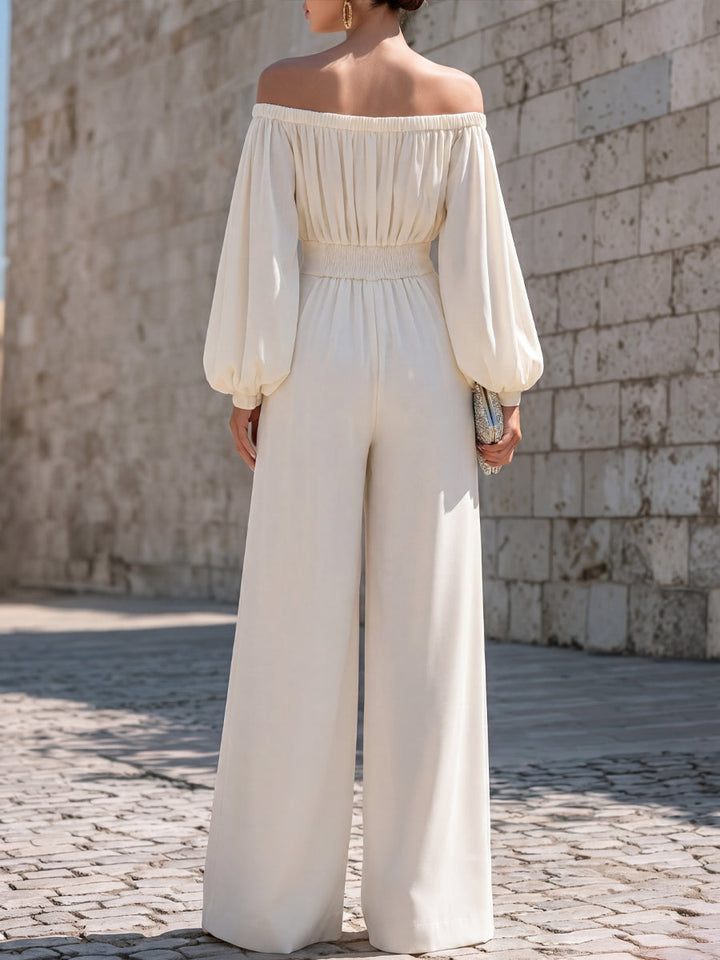 Women's white off-shoulder maxi dress with flowing bishop sleeves, ideal for special occasions.