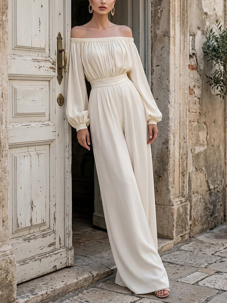 Sophisticated white off-shoulder maxi dress with bishop sleeves, ideal for evening events.